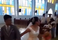 Watch a Couple tread water to get married in a flooded Philippines church